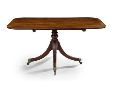 A Regency rosewood crossbanded mahogany breakfast table, first quarter 19th century, the rounded rectangular tilt top with re