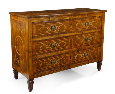 A Louis XVI marquetry, walnut and fruitwood commode, last quarter 18th century, with three drawers, on later carved tapering 
