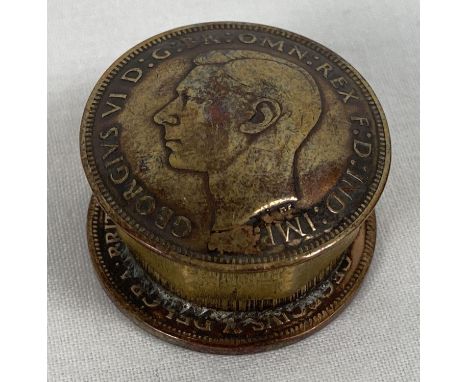 A small metal pill box made from a brass nut and 2 1935 George VI vintage penny coins. Approx. 3cm diameter.  