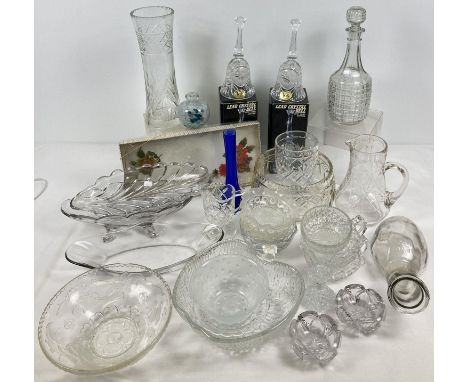 A large collection of assorted vintage and modern glass ware. To include: boxed crystal bells, decanter, fruit bowls and boxe