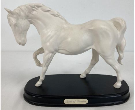 A Royal Doulton "Spirit of Freedom" ceramic horse figurine mounted on a wooden plinth. In white matt finish. No signs of dama