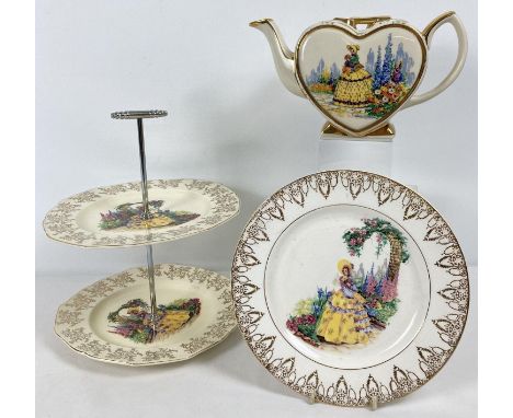 3 pieces of vintage ceramics decorated with Crinoline lady design and floral gilt detail. A heart shaped teapot with key desi