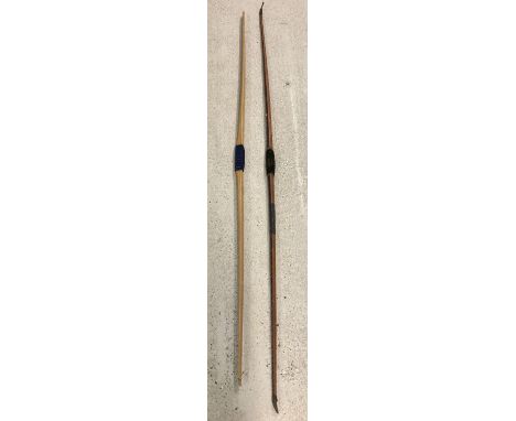 2 vintage wooden longbows. A light wood Slazenger 52lb draw-weight longbow. Together with a darker striped wood 48lb draw-wei