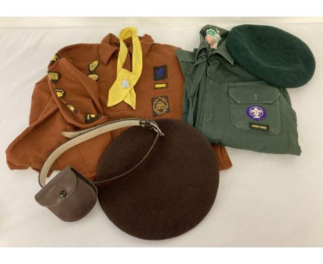 A vintage 1970's Brownie uniform and cub scout shirt and beret together with a quantity of badges. Brownie uniform includes n