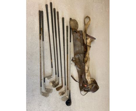 2 vintage canvas and leather pencil golf bags (a/f) together with a collection of vintage golf clubs. To include Greensite Dr
