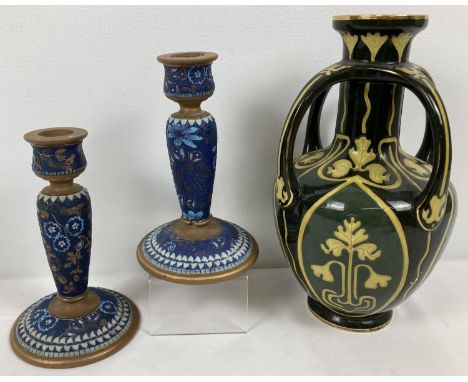 A pair of Doulton Lambeth stoneware candlesticks together an Art Nouveau vase. Blue and brown candlesticks with gilt detailin