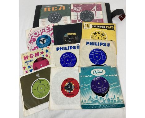 A vintage record folder containing 11 vintage film and TV soundtrack 7" singles. To include "A Fist Full Of Dollars", "Theme 