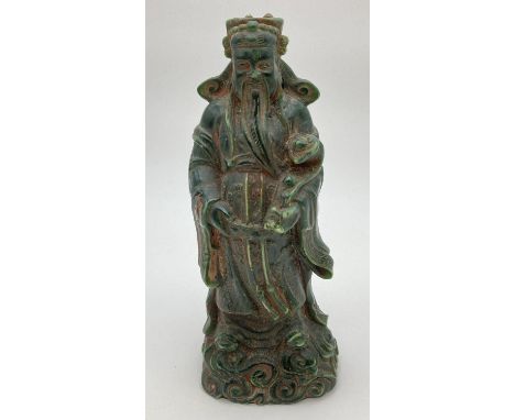 A Chinese carved green jade figurine of an Oriental Deity. Approx. 20cm tall.  