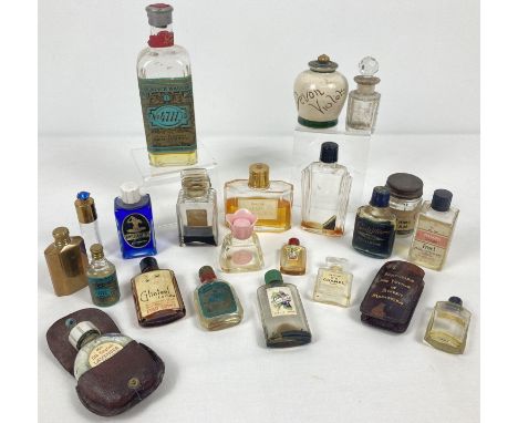A collection of vintage perfume and vanity bottles, some with contents. To include Chanel No. 5, "Brilliantine" by Eugene, "E