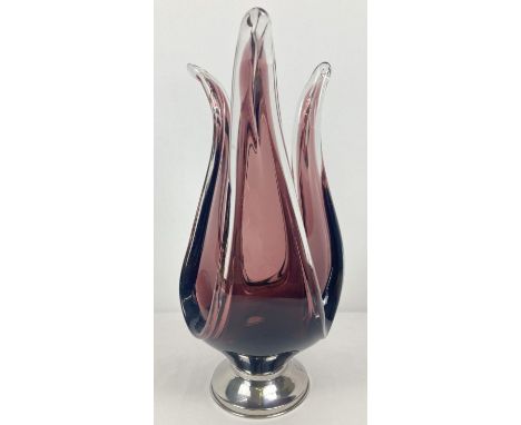 A large vintage aubergine glass dish raised on a stainless steel foot. Approx. 41cm tall.  