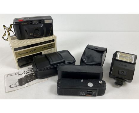 A boxed Goldline Supreme AFP F4.5/35mm camera with case and instructions. Together with a Canon Speedlite flashlight with cas