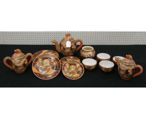 Japanese Satsuma earthenware part tea service decorated with figures and gilt highlights