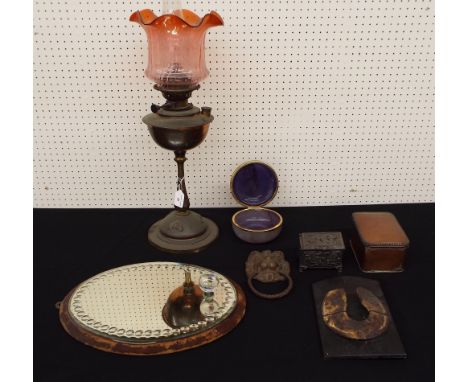 Art Nouveau brass oil lamp with cranberry glass shade, 27" high; together with interesting items to include metal lions head 