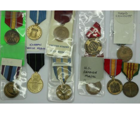 Ten USA medals, including Merchant Marine, Navy medal, Good Conduct, Reserves, Humanitarian Service, Expert Rifleman, Korean 