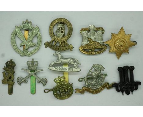 Ten mixed regimental cap / beret badges. P&amp;P Group 1 (£14+VAT for the first lot and £1+VAT for subs 