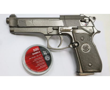 Beretta Co2 pistol, later painted silver / grey, with a tin of pellets. P&amp;P Group 2 (£18+VAT for the first lot and £3+VAT