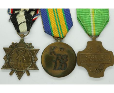 Two WWII medals, including Dutch Labour Tribute ACV and French Aisne Veterans medal, with a Dutch Orderly Medal of the Four D