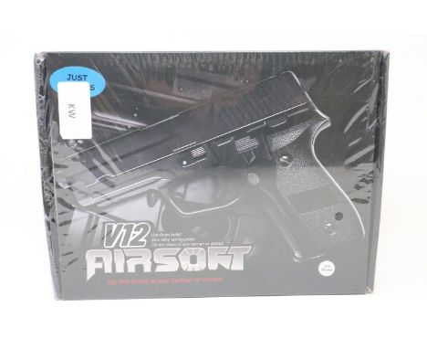 New old stock airsoft pistol, model V12 in brown, boxed and factory sealed. P&amp;P Group 2 (£18+VAT for the first lot and £3