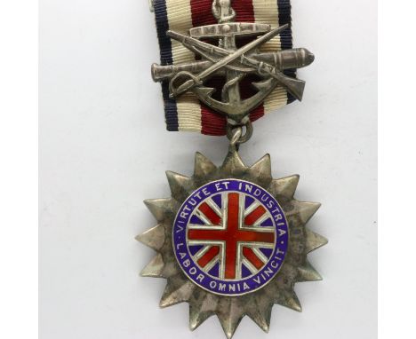 Corps of Commissionaires medal for long and exemplary service, named to R Steele, in enamelled silver by Smith &amp; Wesson. 