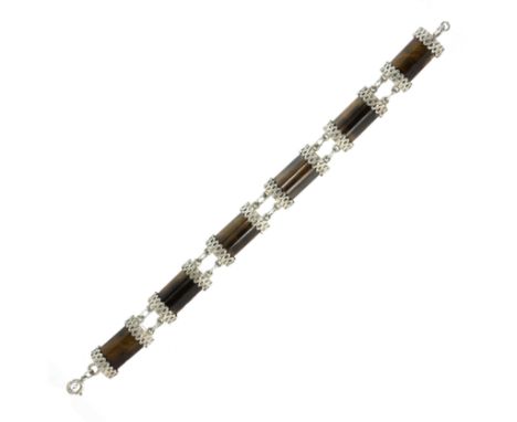 A TIGER'S EYE BRACELET in sterling silver, each of the six links set with a bevelled polished piece of tiger's eye between te