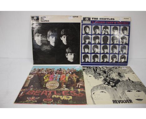 A Collection Of Beatles Records To Include SGT Peppers Lonely Hearts Club Band, Revolver, With The Beatles And A Hard Days Ni