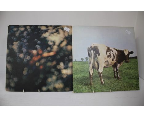 Two Pink Floyd Albums, Atom Heart Mother and Obscured By Clouds.  Atom Heart Mother is a first Pressing and Obscured By Cloud