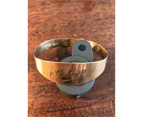 Yellow metal bangle marked ET+9ct engraved Marion 10.1 gms