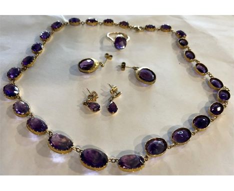 Fine quality amethyst suite inc. necklace 43 cms long, ring size L and 2 pairs of earrings set in unmarked yellow metal 