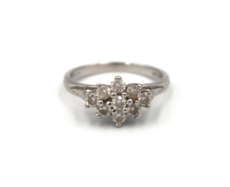 A platinum brilliant cut diamond cluster ring. Estimated total diamond weight 0.50ct. Size K. Weight 3.19 grams