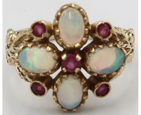 A 9ct yellow gold Victorian style opal and ruby ring, opals are a good colour and well matched, head size approx 17mm x 17mm,