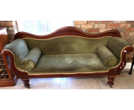 A 19th century mahogany scroll arm settee on turned legs, sound condition but needs re-covering, 190cm wide