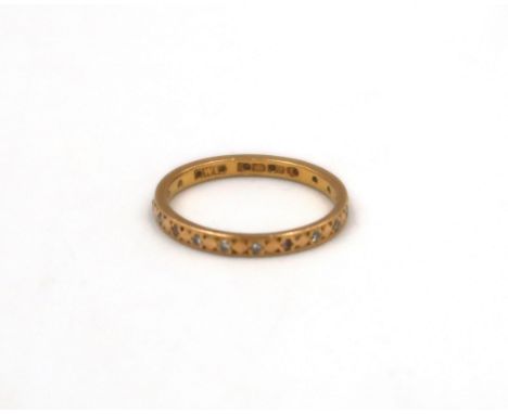A 22ct yellow gold and diamond eternity ring 2.6 grams, size J/K.