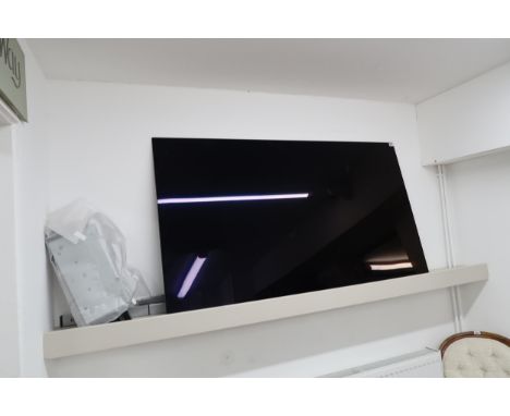 An LG 65'' flat screen T.V. with wall mounting bracket and stand. Model No.OLED65C14LB. Serial Number. 105MAJM61B12.