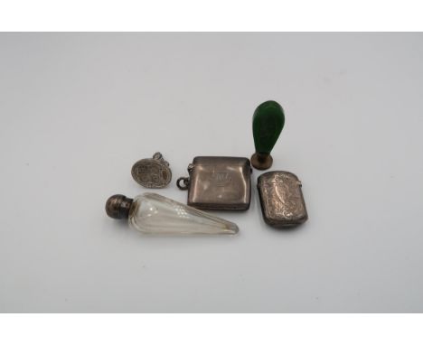 A silver hallmarked vesta case with embossed decoration, a seal with jade handle and one other