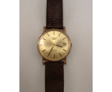 A 9ct yellow gold Rotary wristwatch, baton markers with date aperture at 3 o clock, champagne coloured dial, case diameter 3c