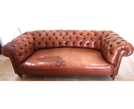 A 19th century Howard style country house large button back Chesterfield settee with a nice faded patina, seat with damage an