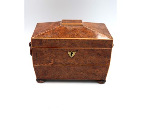 A birds eye maple veneered tea caddy on bun feet, 19cm x 11.4cm x 16cm high