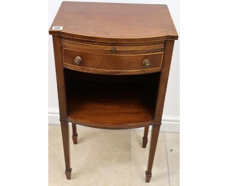 A Mahogany and line inlaid bow fronted bedside table with brushing slide above single drawer over shelf raised on square tape