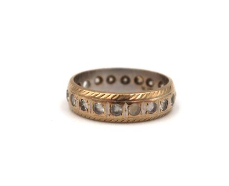 A 9ct gold white stone full eternity ring. Size K. Weight 2.49 grams. One stone missing.