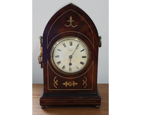 A mahogany case with brass inlay, 8 day gothic style mantle clock