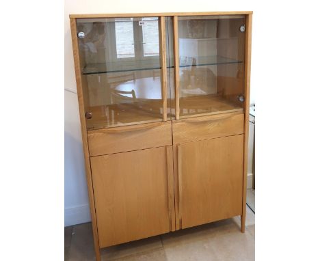 An Ercol Pinter glazed cabinet Ref 877 30635 height 150cm x width 100cm x depth 45cm.