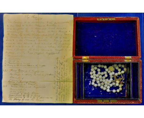 Rosary in small box  With hand written explanation of the Five Mysteries in a small leather(ette?) box.  A truly nice item.