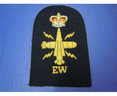 Royal Navy Submarine Trade Patch. Embroidered in Gold Bullion with letters EW with a QC