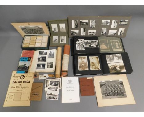A white metal mounted Ptarmigan claw twinned with vintage photo albums, relating to the Fuge family, twinned with other ephem