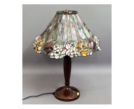 A Tiffany style lamp with coloured glass shade, 23in high 