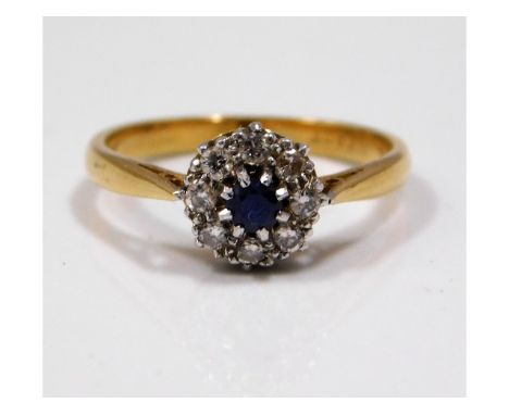 An 18ct gold diamond &amp; mid blue sapphire ring, size M, 3.2g