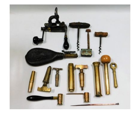 A leather powder flask, two powder measures, a cartridge maker, two antique cork screws &amp; other items