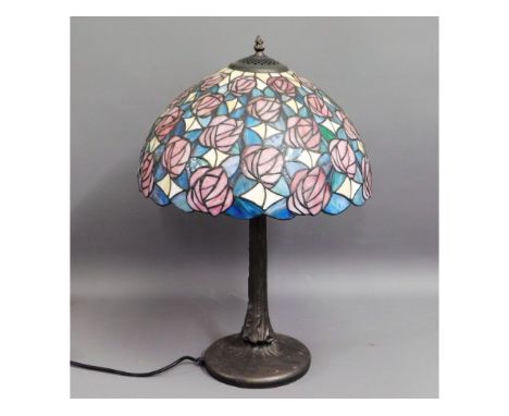 A Tiffany style lamp with coloured glass shade, 23.5in high £30-40
