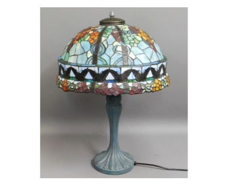 A Tiffany style lamp with coloured glass shade, 26in high