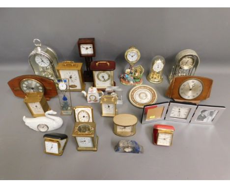 A brass carriage clock, a lapis lazuli mounted quartz clock movement &amp; other clocks